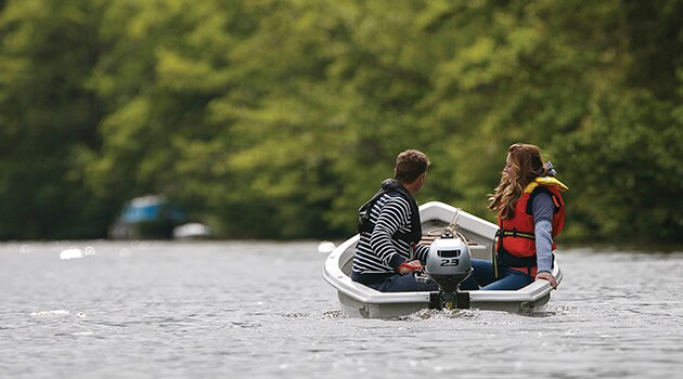 Two people in a boat being propelled by a BF 2.3